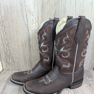 Corral tan leather boot with brown trim and teal logo